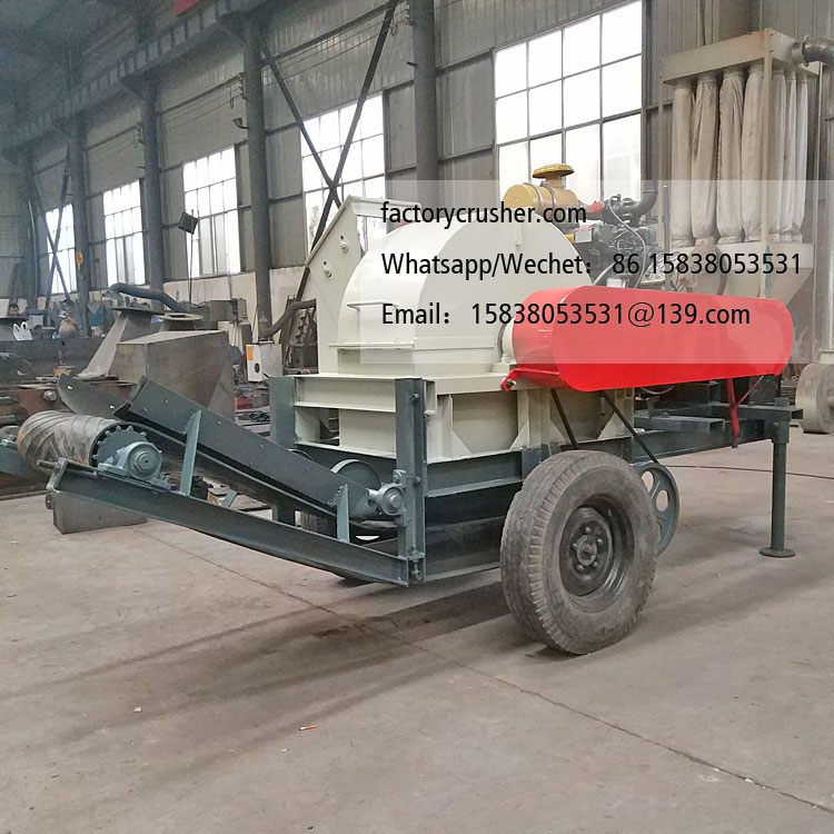 Large mobile diesel-powered wood chipper, wood shredder, with discharge conveyor belt.
