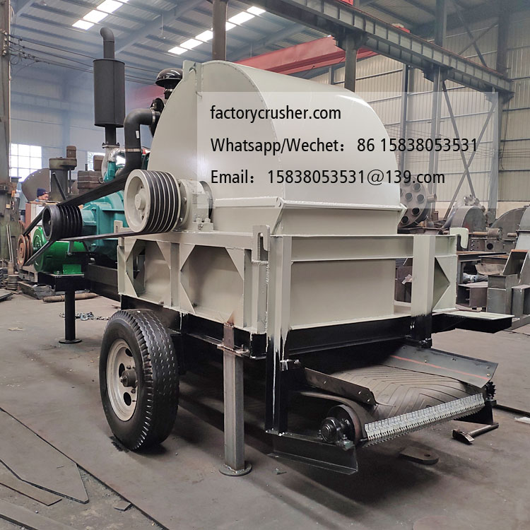 Large mobile diesel-powered wood chipper, wood shredder, with discharge conveyor belt.